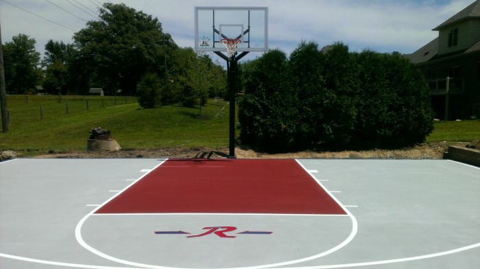 Red and light gray key with white highschool and college three point lines 