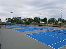 Light blue and gray tennis courts