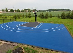 Blue basketball court with black lane
