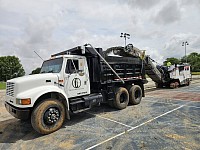 Outdoor Court Specialists dump truck